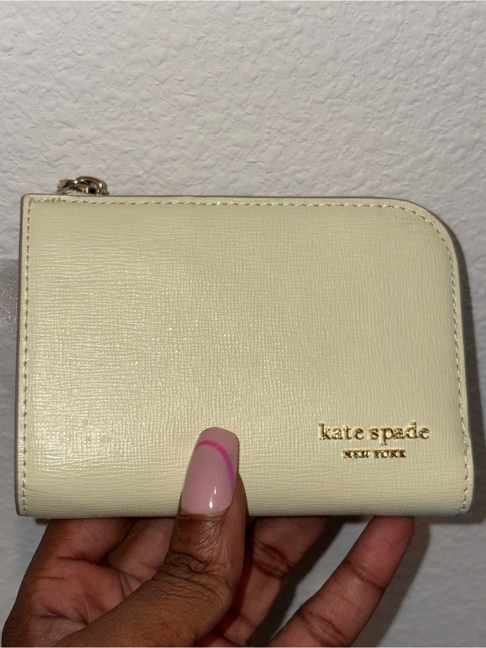 kate spade cream zip-around wallet with gold logo